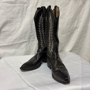 Vintage Black Tony Lama western boots made of leather.